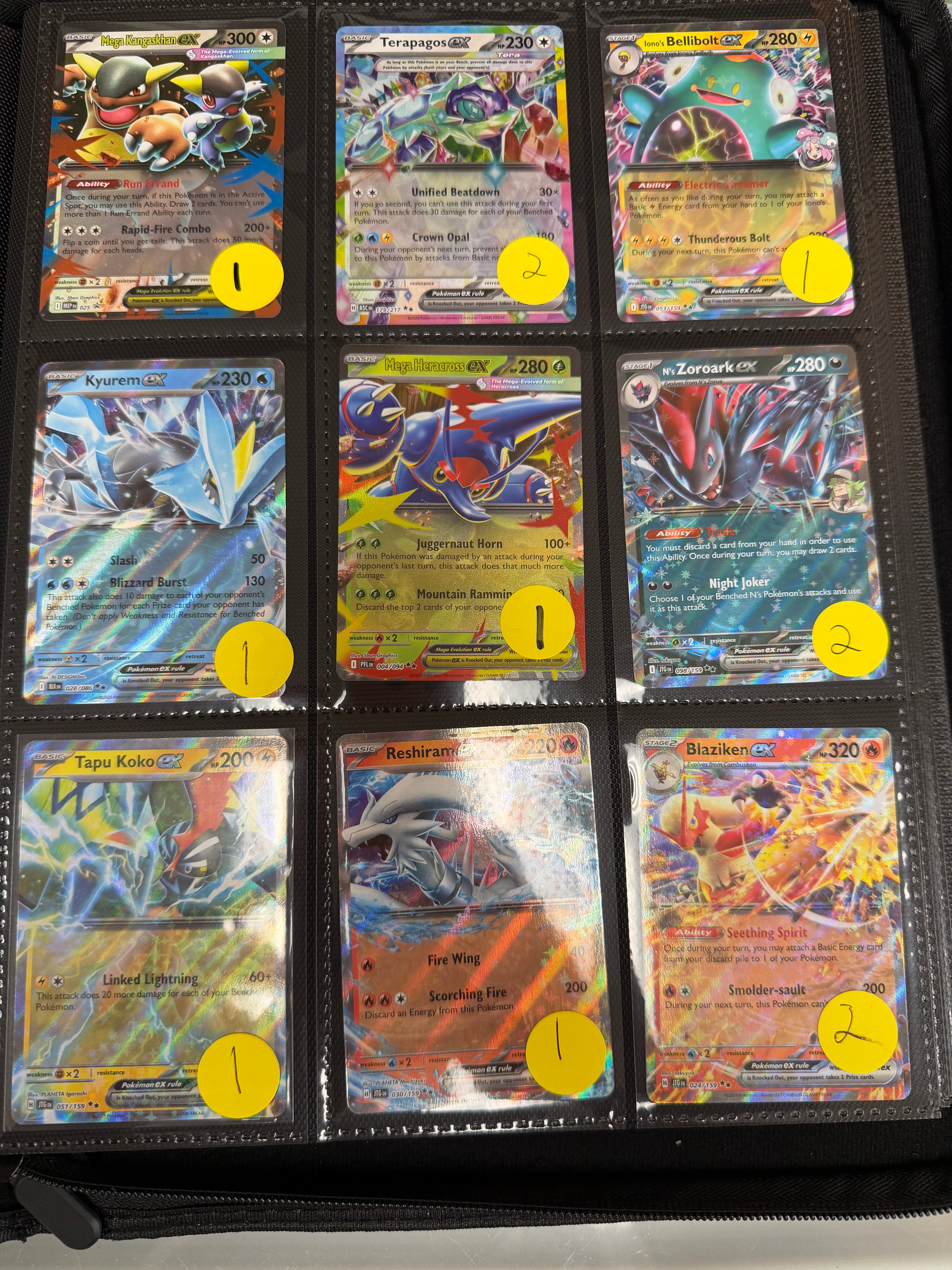 Nine holographic Pokémon cards in a binder page, each with a yellow numbered sticker.